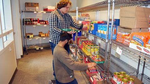 Students stocking Fuel Pantry shelves